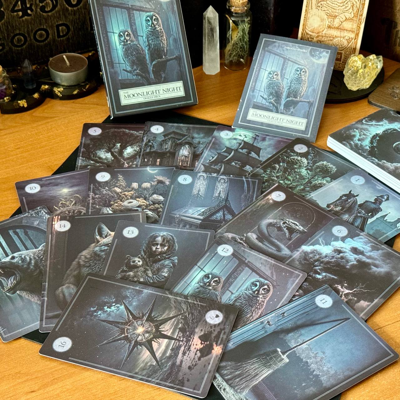 a collection of tarot cards spread out on a table, with various illustrations and scenes depicted on the cards.