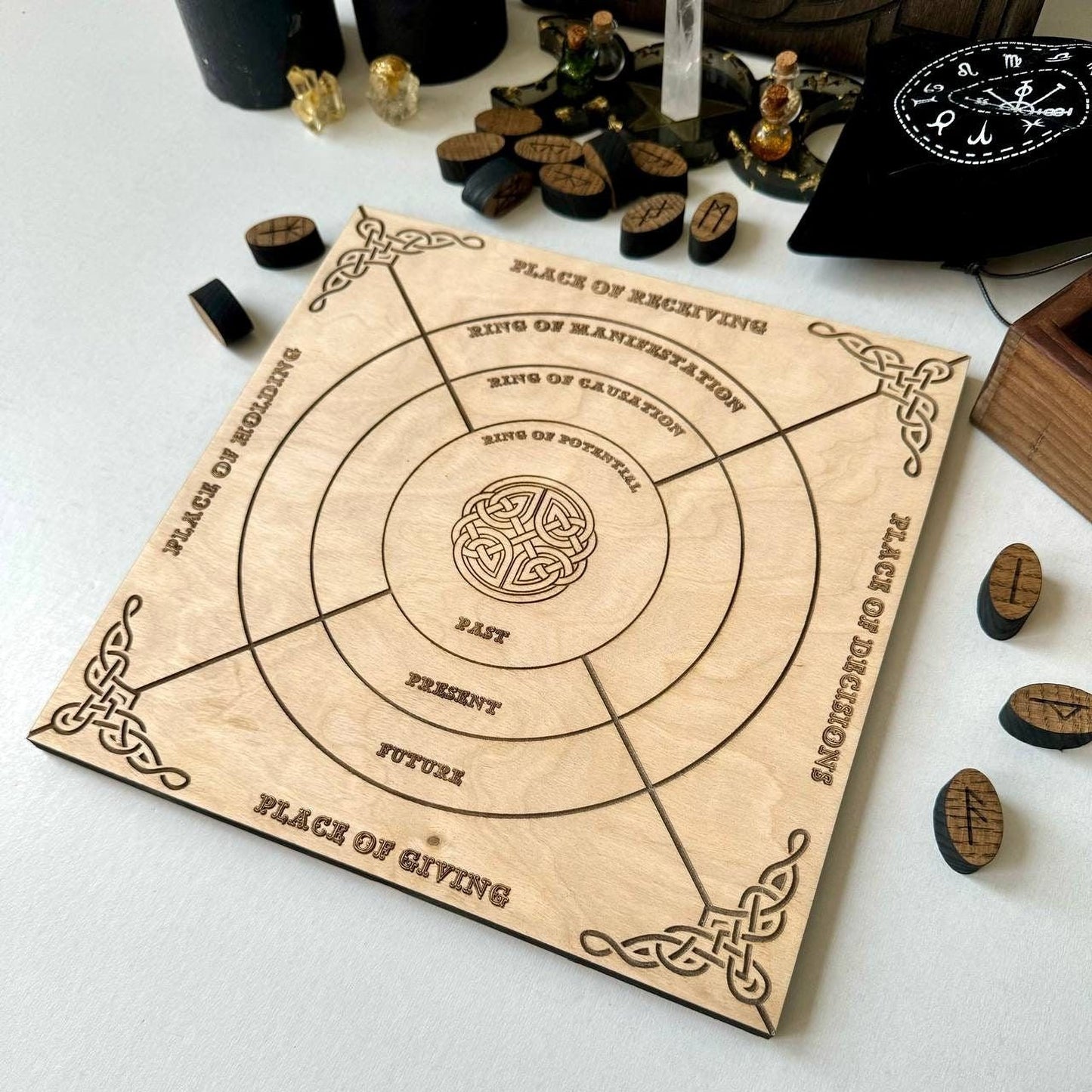 a wooden board game with intricate carvings and text, placed on a white surface.