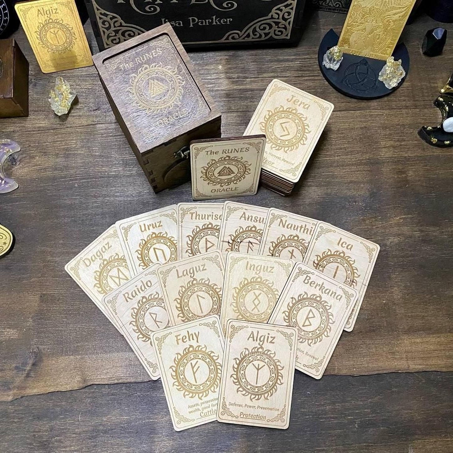 a collection of wooden cards with various symbols and text, arranged on a wooden surface.