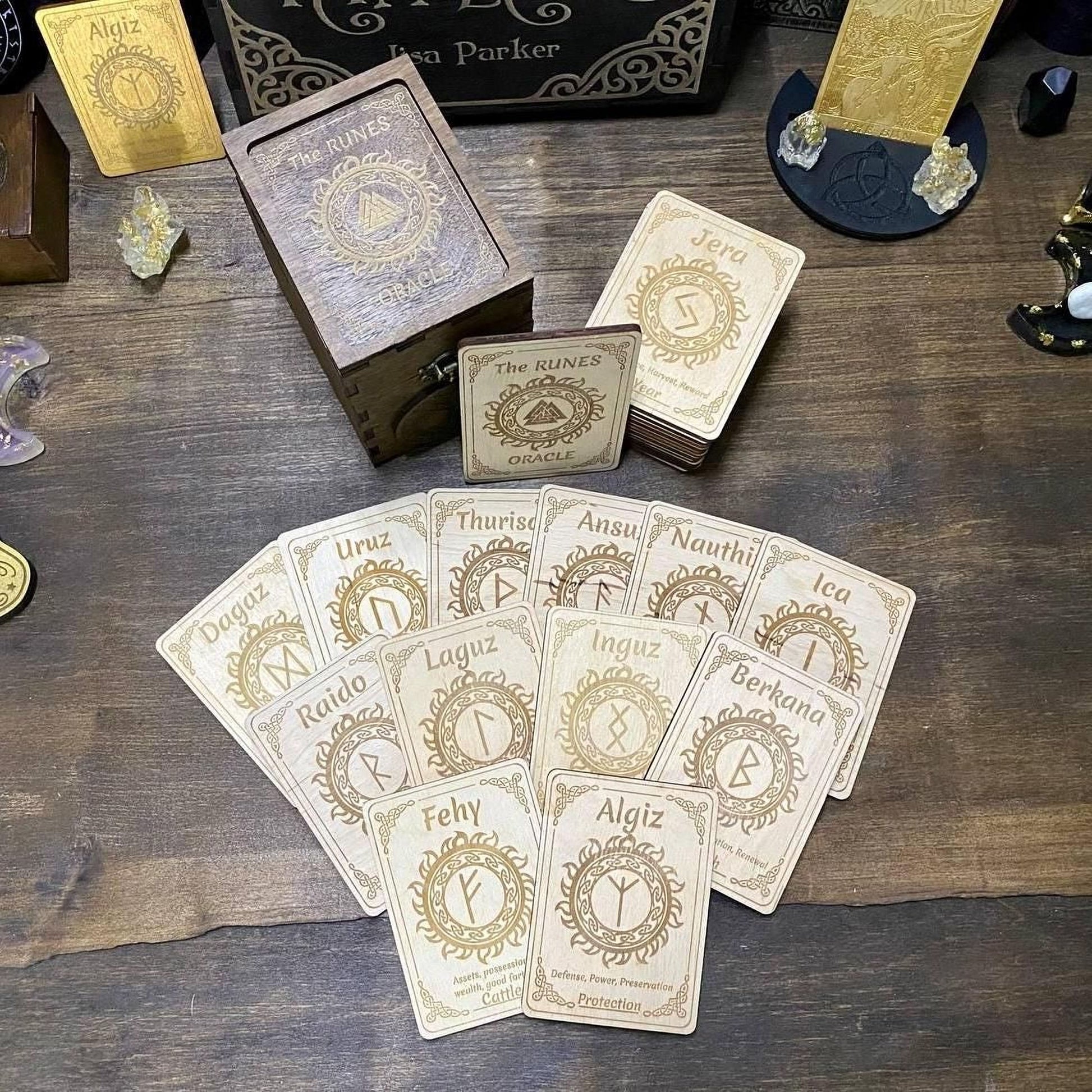 a collection of wooden cards with various symbols and text, arranged on a wooden surface.