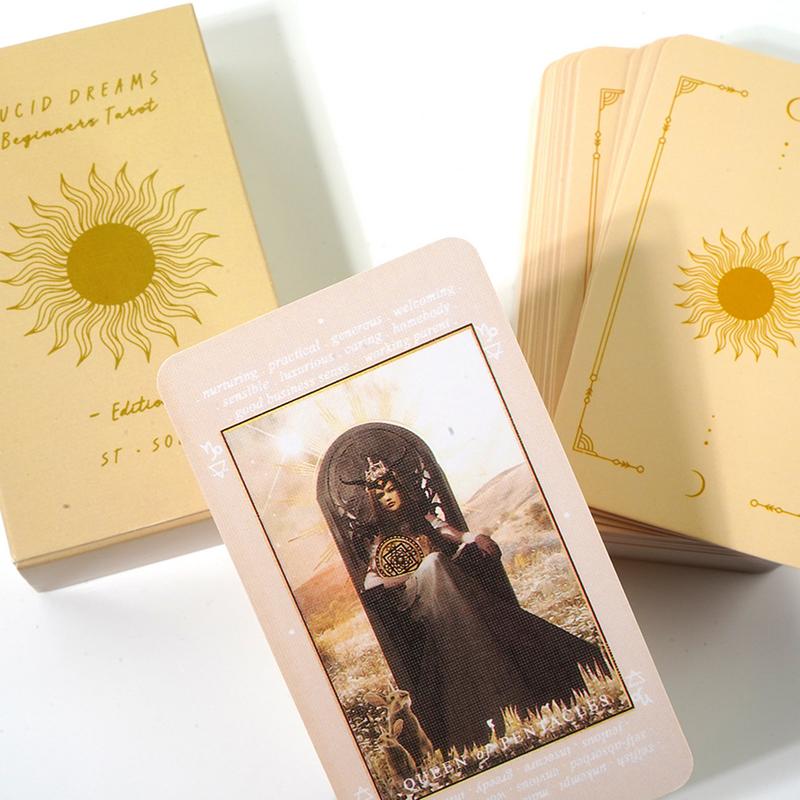 a tarot deck with a card depicting a woman in a dark dress and a crown, surrounded by a desert landscape.