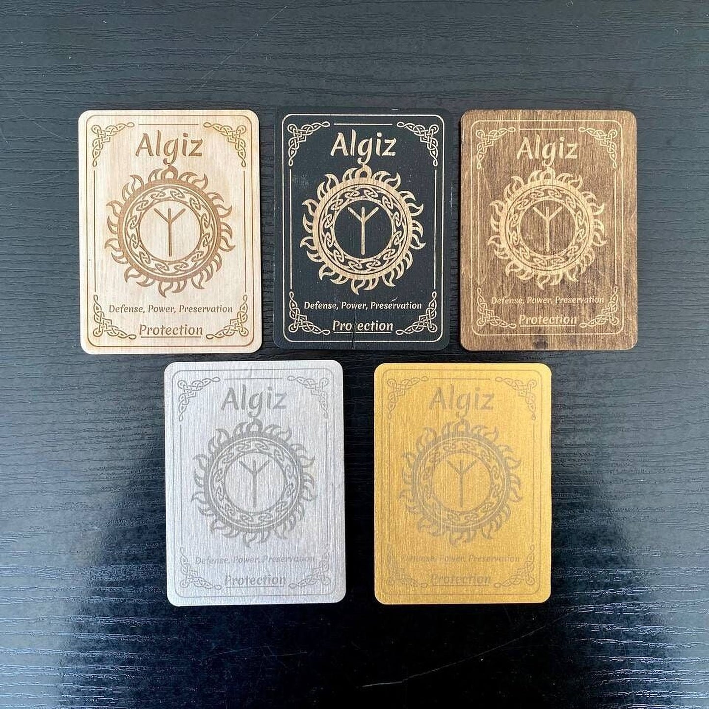 five cards with the name "Algiz" printed on them, each with a different color background.