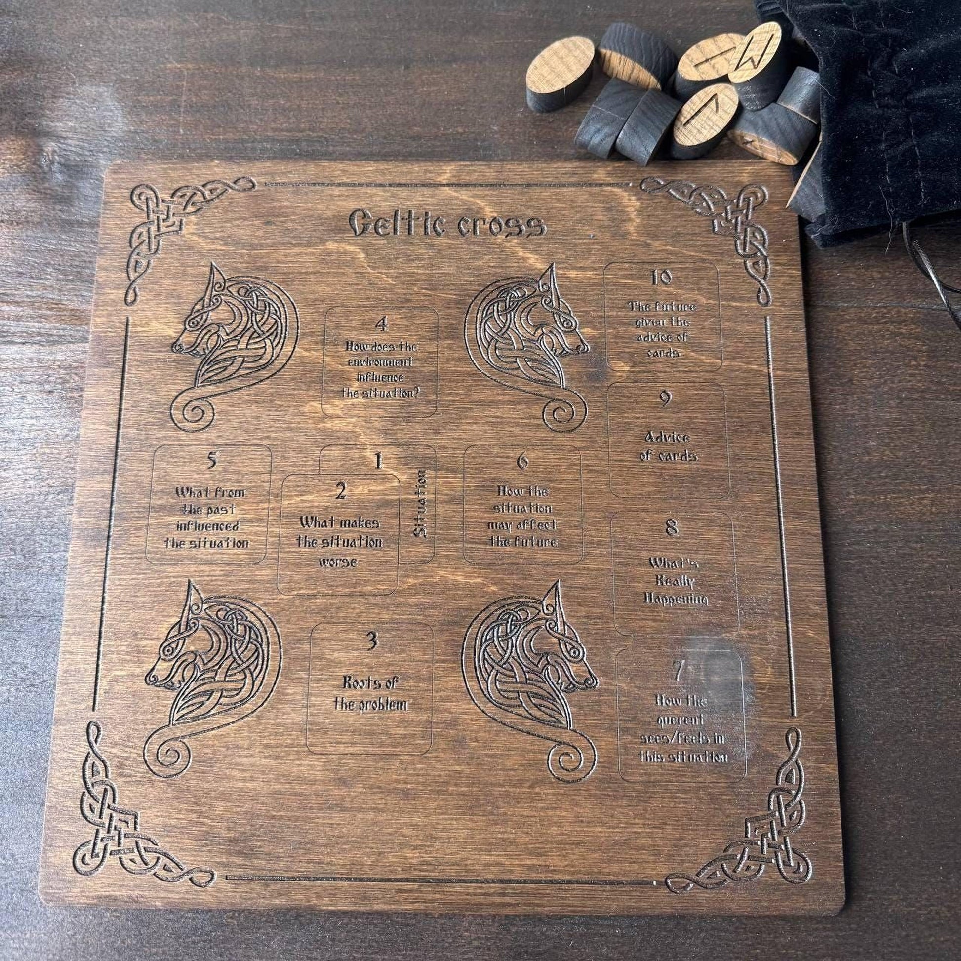 a wooden board with a Celtic cross design and some cork pieces on top.