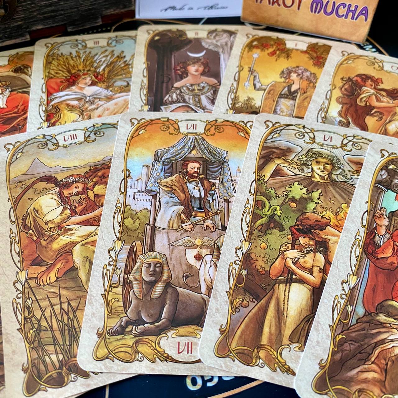 a collection of illustrated tarot cards with various scenes and characters depicted on their covers.