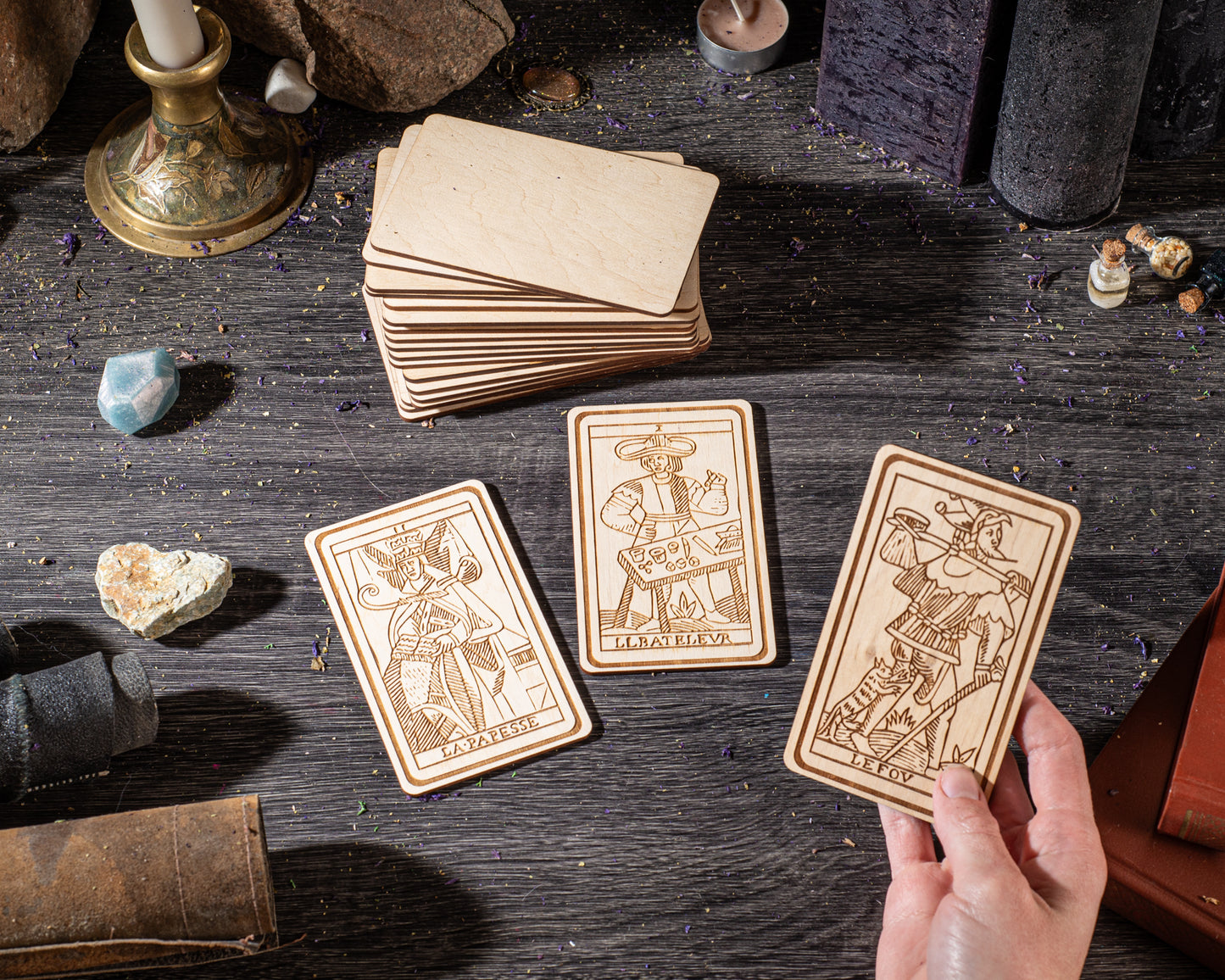 Close-up of Tarot de Marseille cards showing detailed symbolic artwork