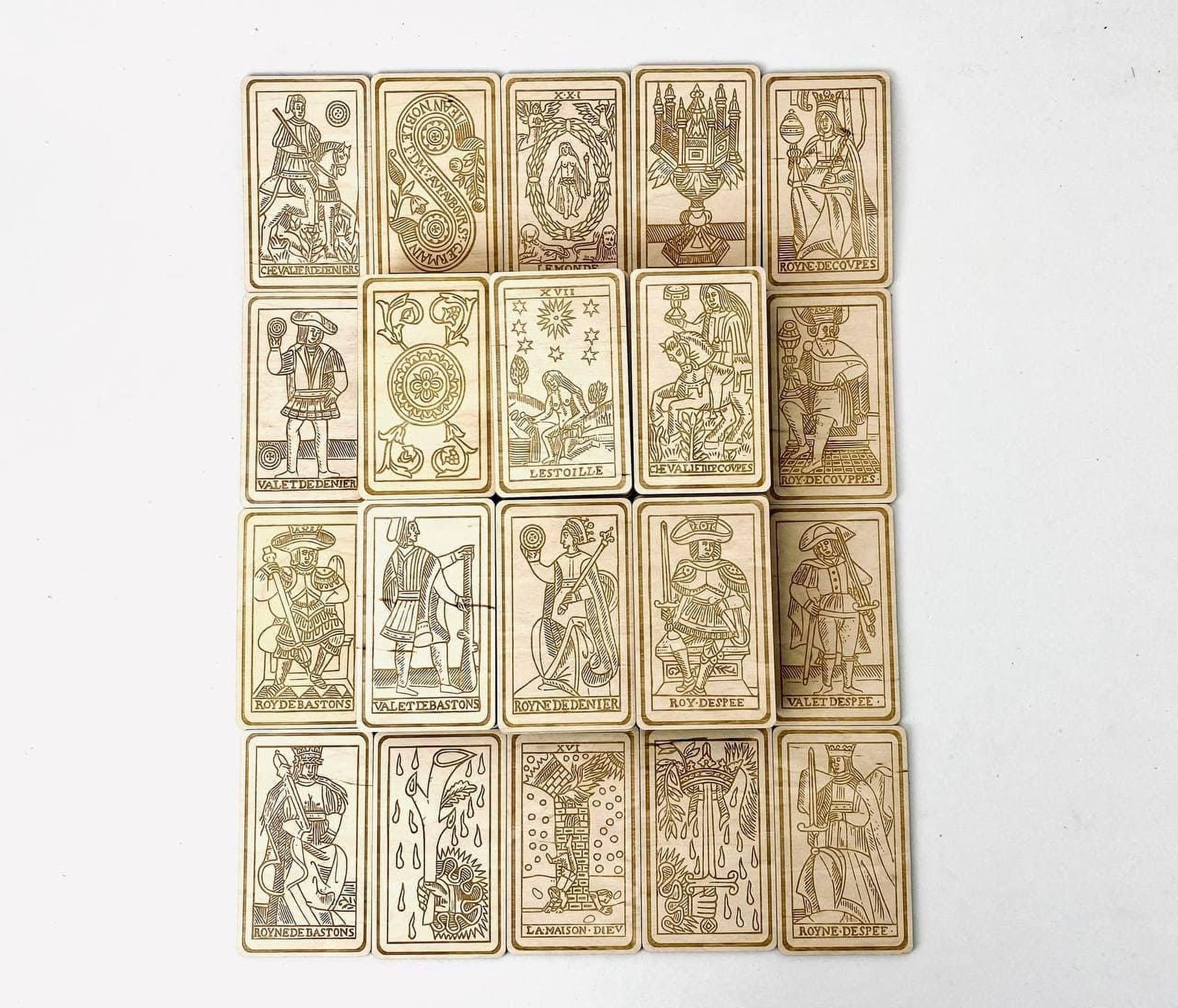 a collection of 16 tarot cards arranged in a grid-like pattern.