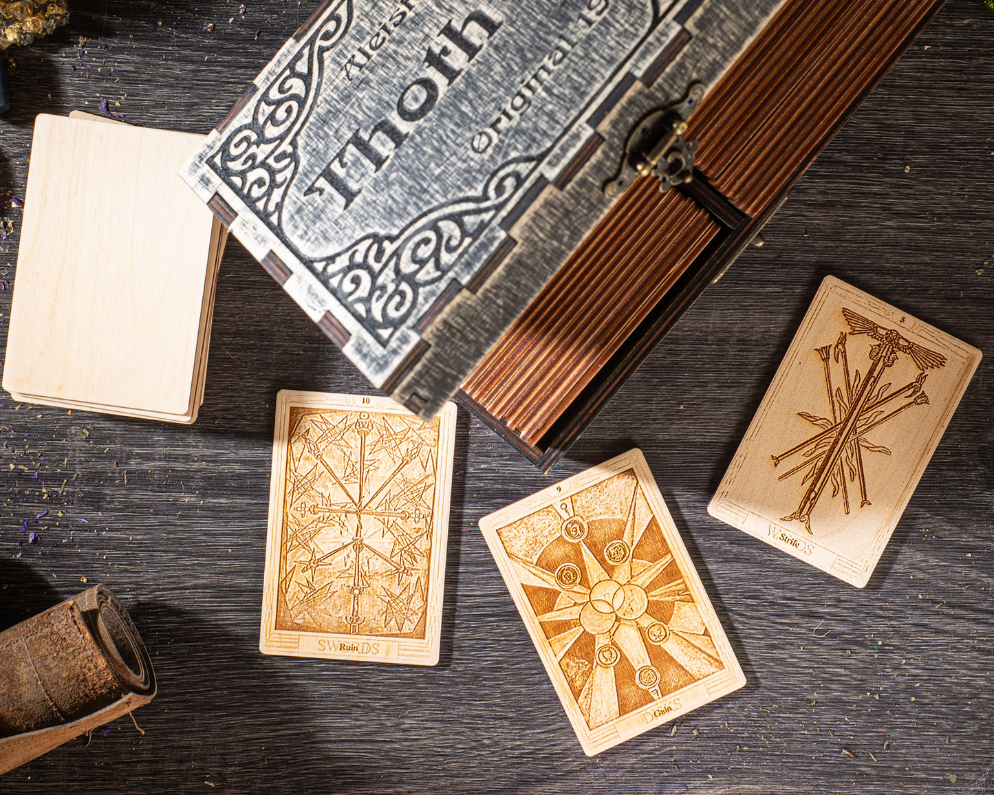a collection of wooden tarot cards and a wooden box with intricate designs, all placed on a wooden surface.