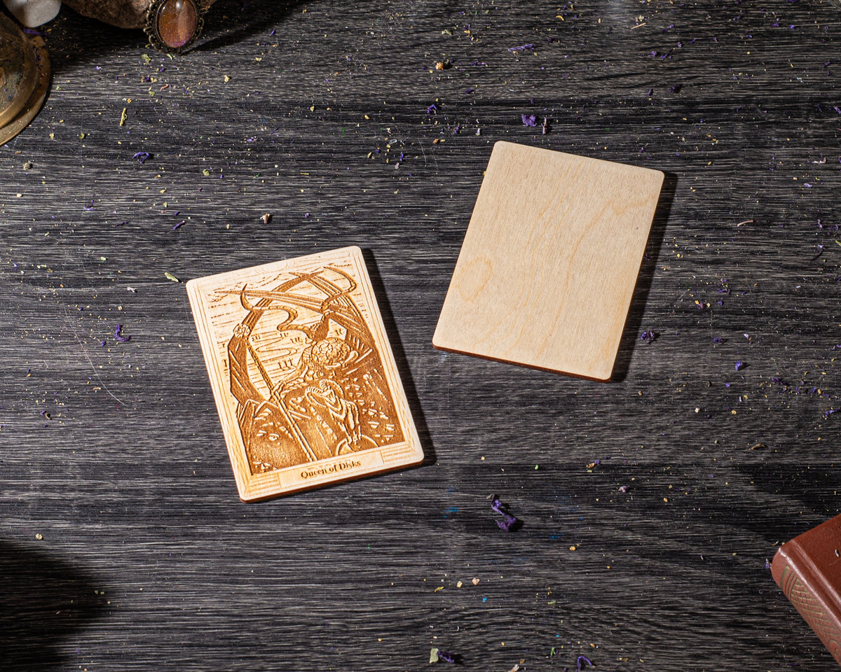 a wooden coaster with a carved design, placed on a wooden surface with scattered wood shavings.