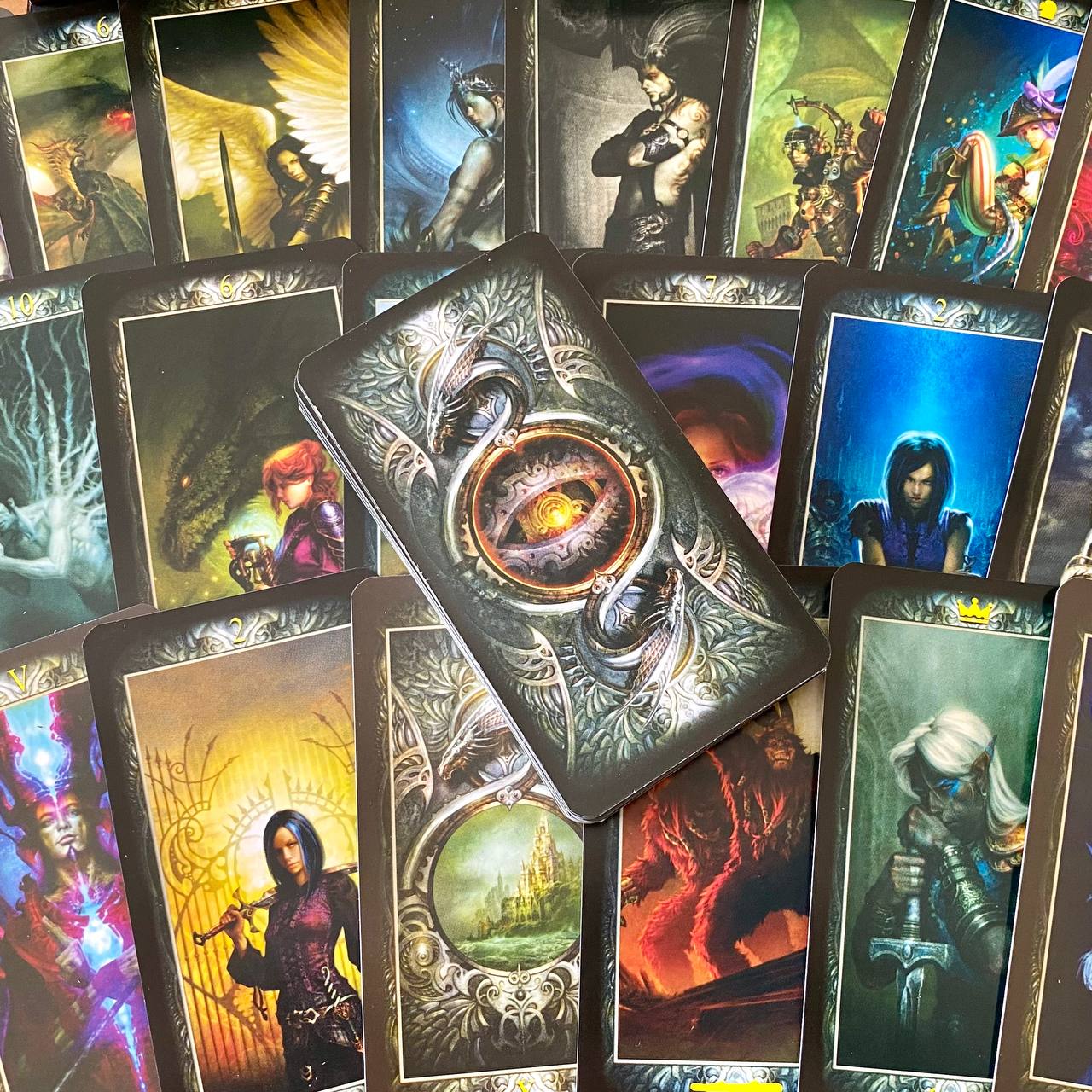 a collection of fantasy-themed tarot cards, each featuring unique illustrations and designs.