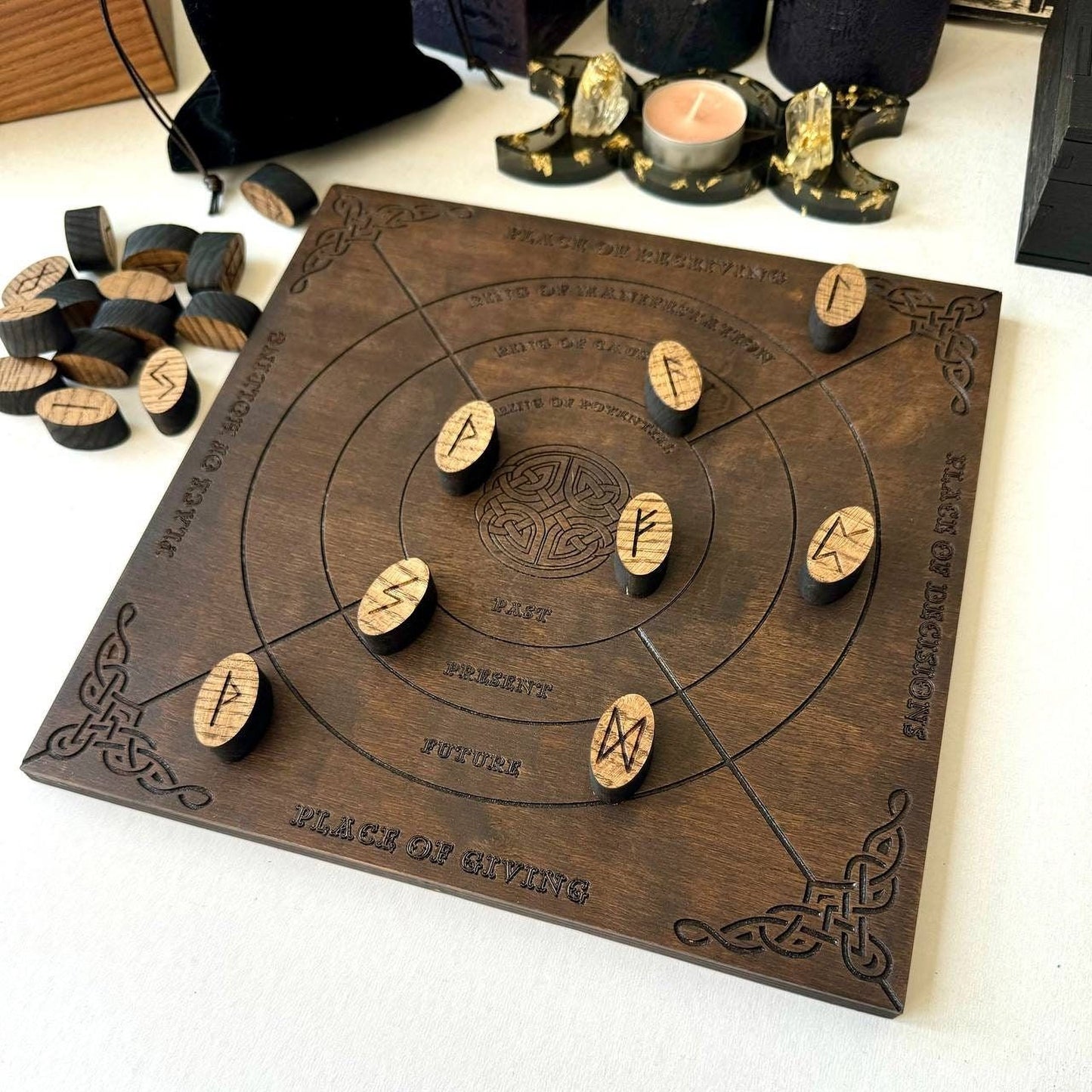 a wooden board with various carved symbols and wooden pieces, including a group of carved wooden pieces and a group of carved wooden pieces.