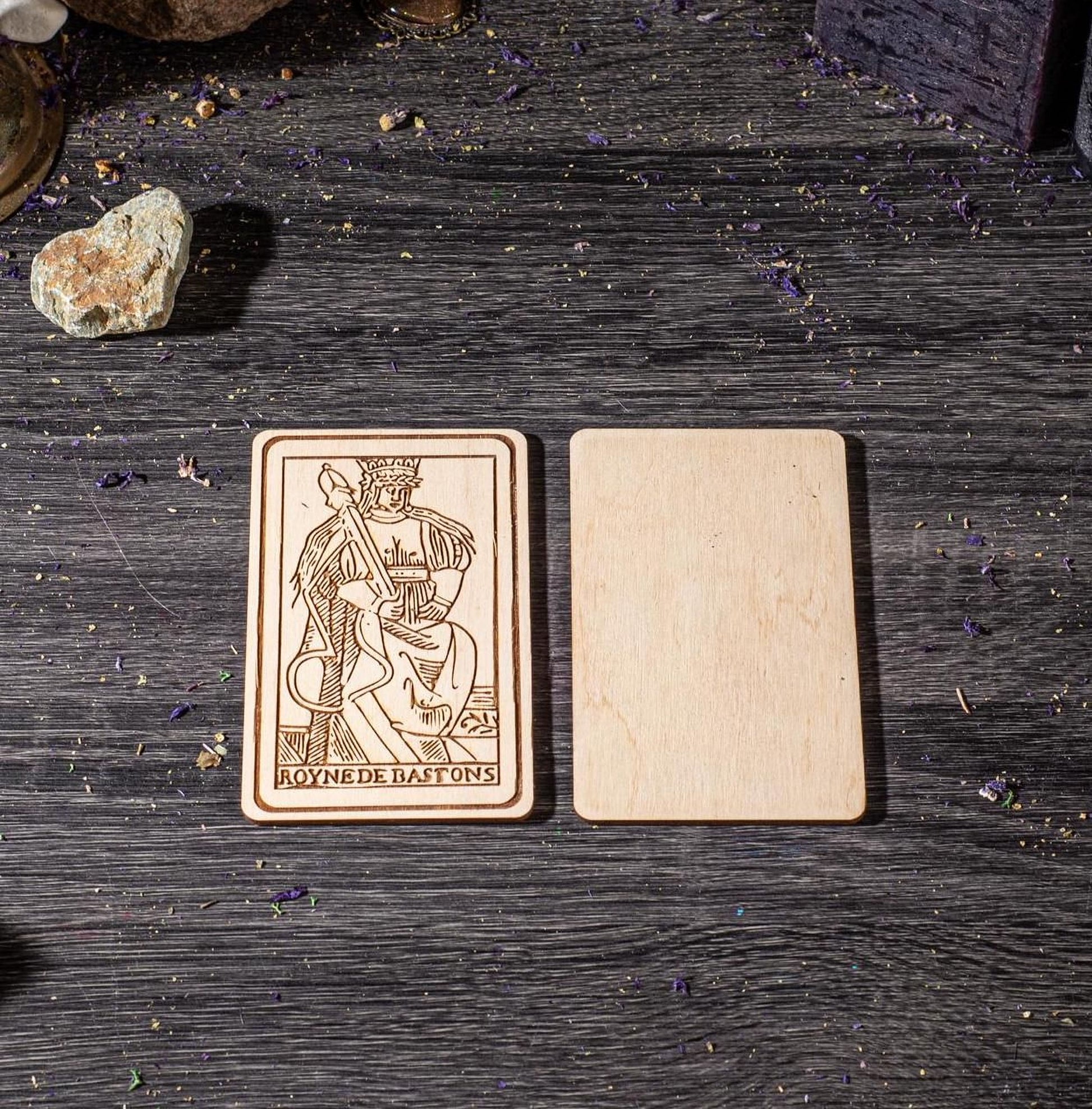 a wooden card with a picture of a man on it, placed on a wooden surface.