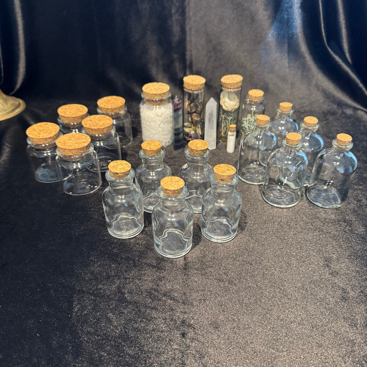 Clear glass bottles with cork stoppers for spells