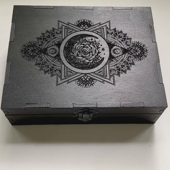 Wooden tarot storage box interior with compartments for tarot decks and accessories on video