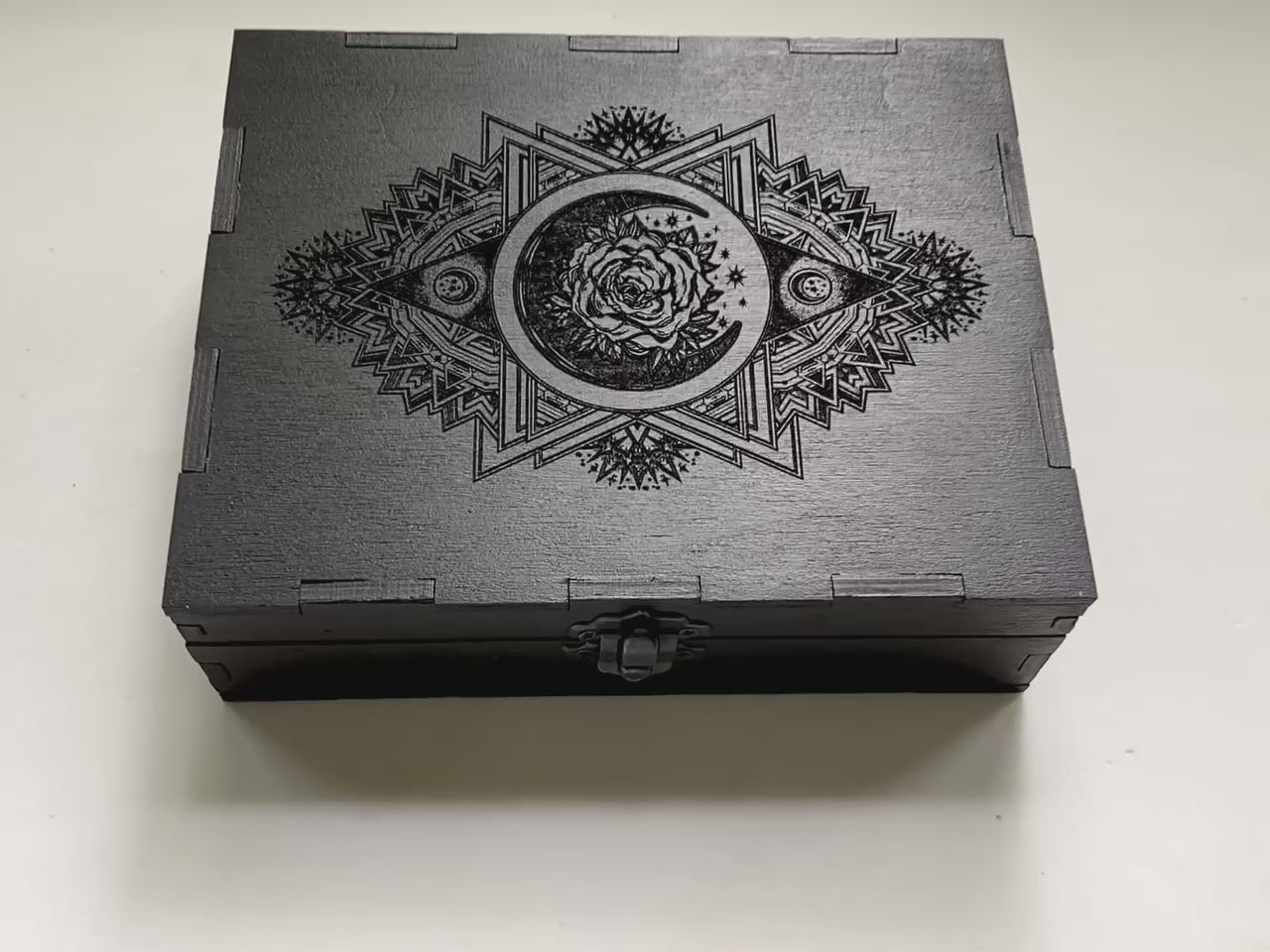 Wooden tarot storage box interior with compartments for tarot decks and accessories on video